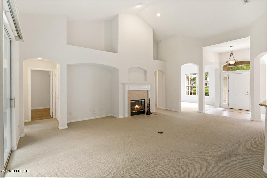 2576 Benjamin Road Jacksonville, FL 32223 - Photo 16 of 53 a view of a livingroom with an empty space and a fireplace