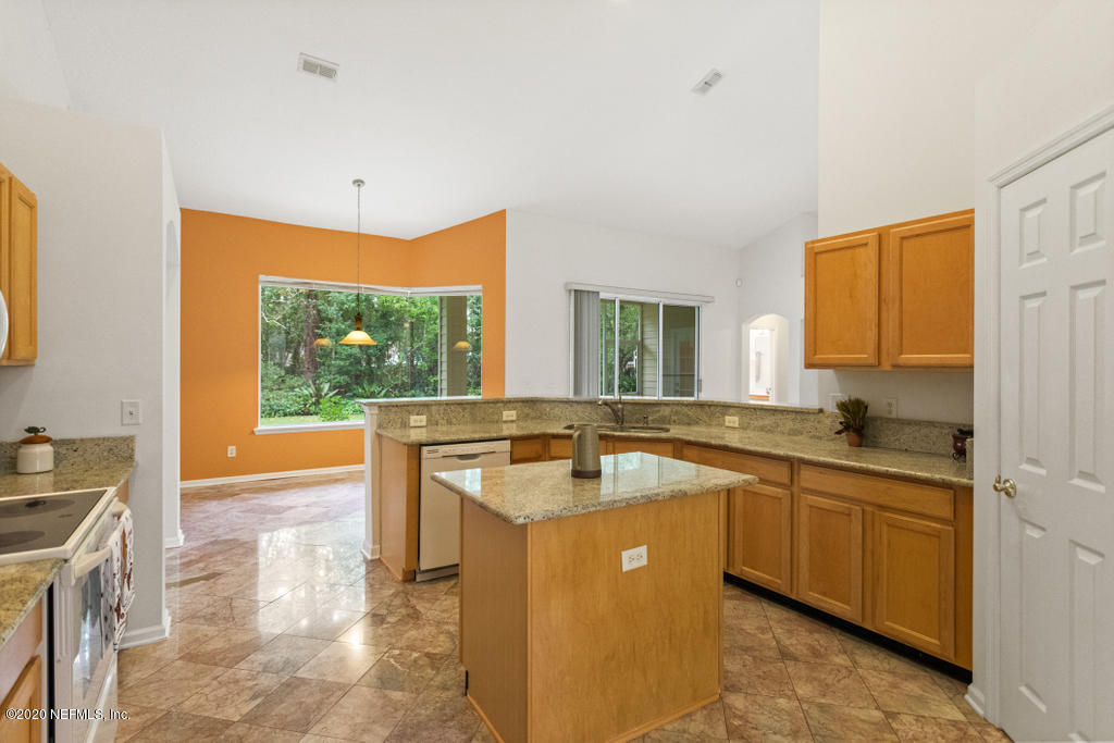 2576 Benjamin Road Jacksonville, FL 32223 - Photo 18 of 53 a kitchen with stainless steel appliances granite countertop a sink and a stove