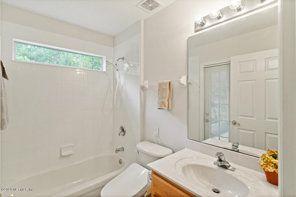2576 Benjamin Road Jacksonville, FL 32223 - Photo 34 of 53 a bathroom with a sink toilet and shower