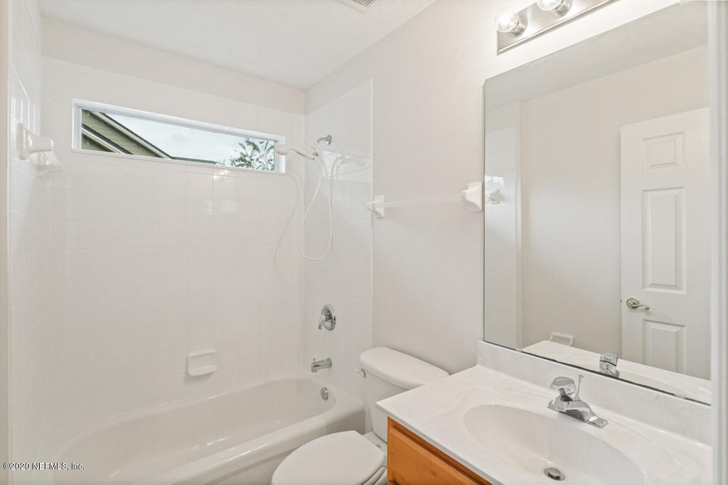 2576 Benjamin Road Jacksonville, FL 32223 - Photo 37 of 53 a bathroom with a sink toilet and shower