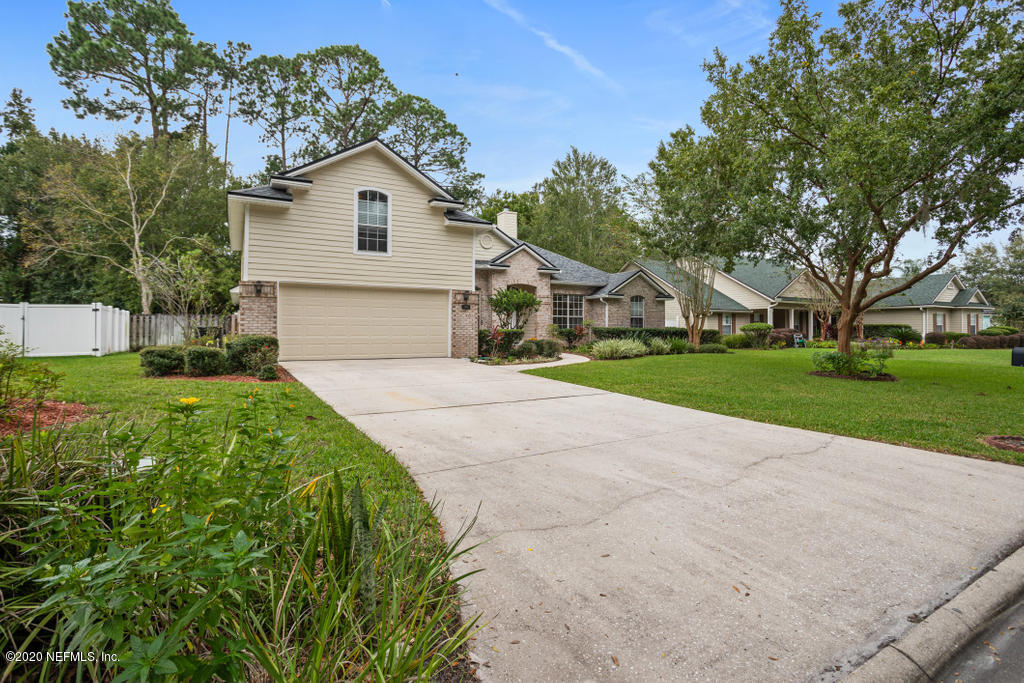 2576 Benjamin Road Jacksonville, FL 32223 - Photo 4 of 53 a view of house with yard and green space