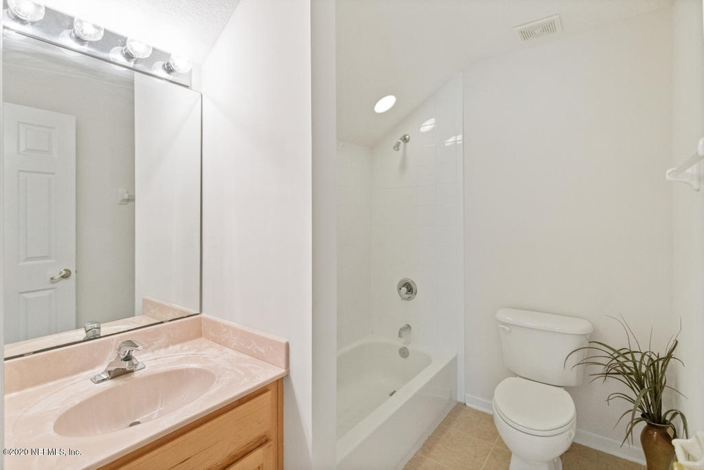 2576 Benjamin Road Jacksonville, FL 32223 - Photo 45 of 53 a bathroom with a sink a toilet and shower