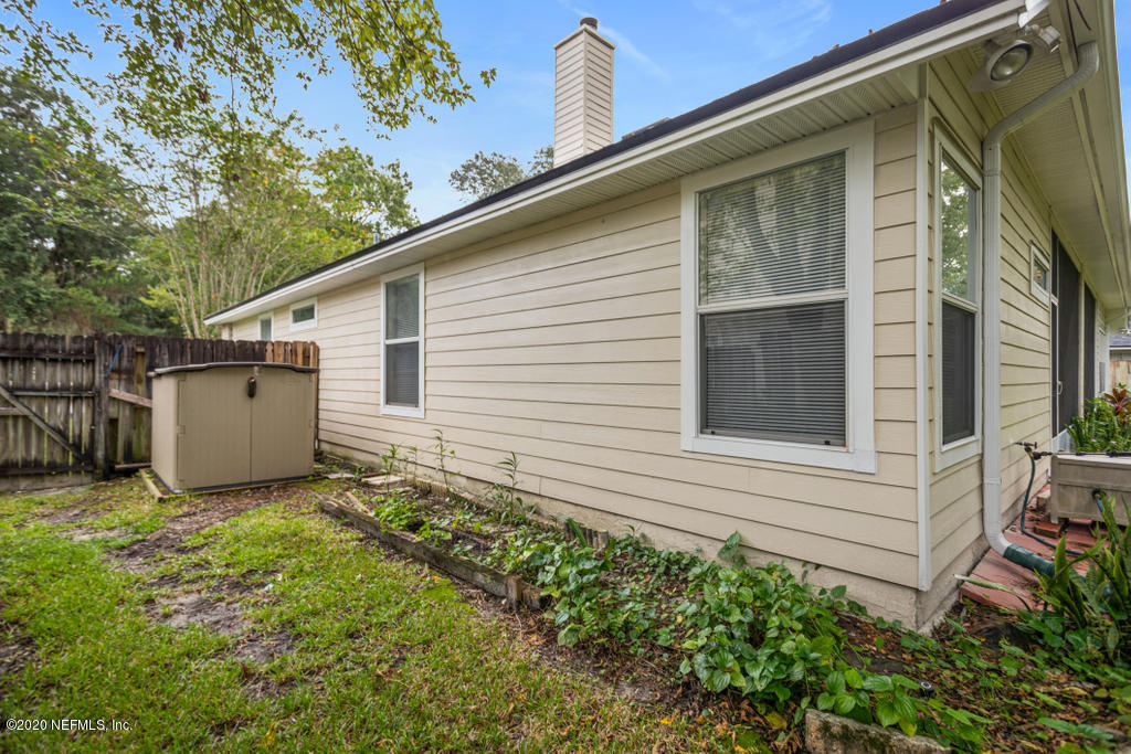 2576 Benjamin Road Jacksonville, FL 32223 - Photo 48 of 53 a view of a house with a yard