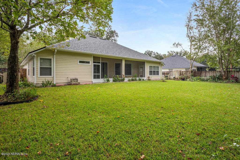 2576 Benjamin Road Jacksonville, FL 32223 - Photo 49 of 53 a front view of a house with yard and green space