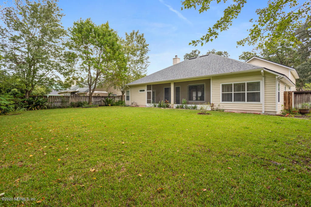 2576 Benjamin Road Jacksonville, FL 32223 - Photo 51 of 53 a view of a house with a yard