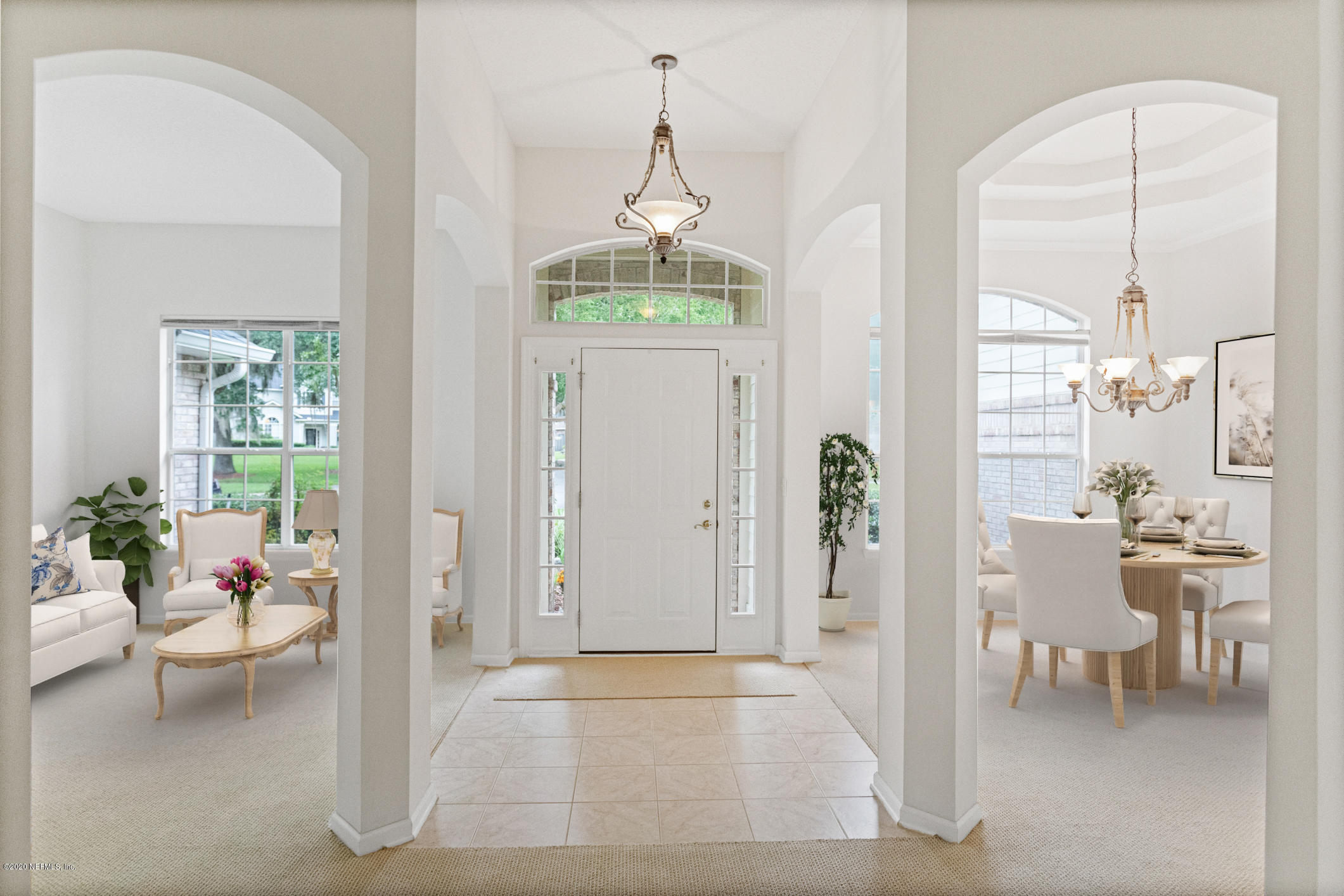 2576 Benjamin Road Jacksonville, FL 32223 - Photo 7 of 53 a hallway with a dining table and a chandelier