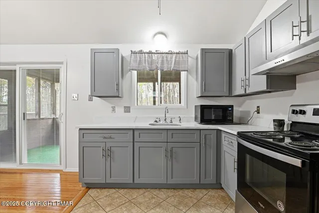 a view of a livingroom with furniture and windows