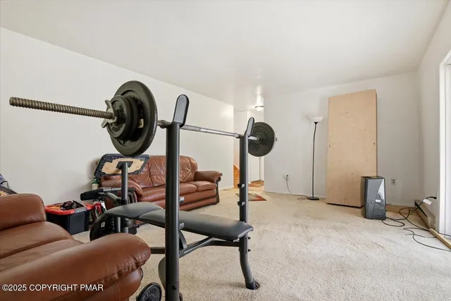 a bathroom with a toilet a sink and a mirror