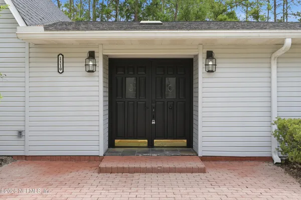 a large kitchen with granite countertop lots of counter space and sink