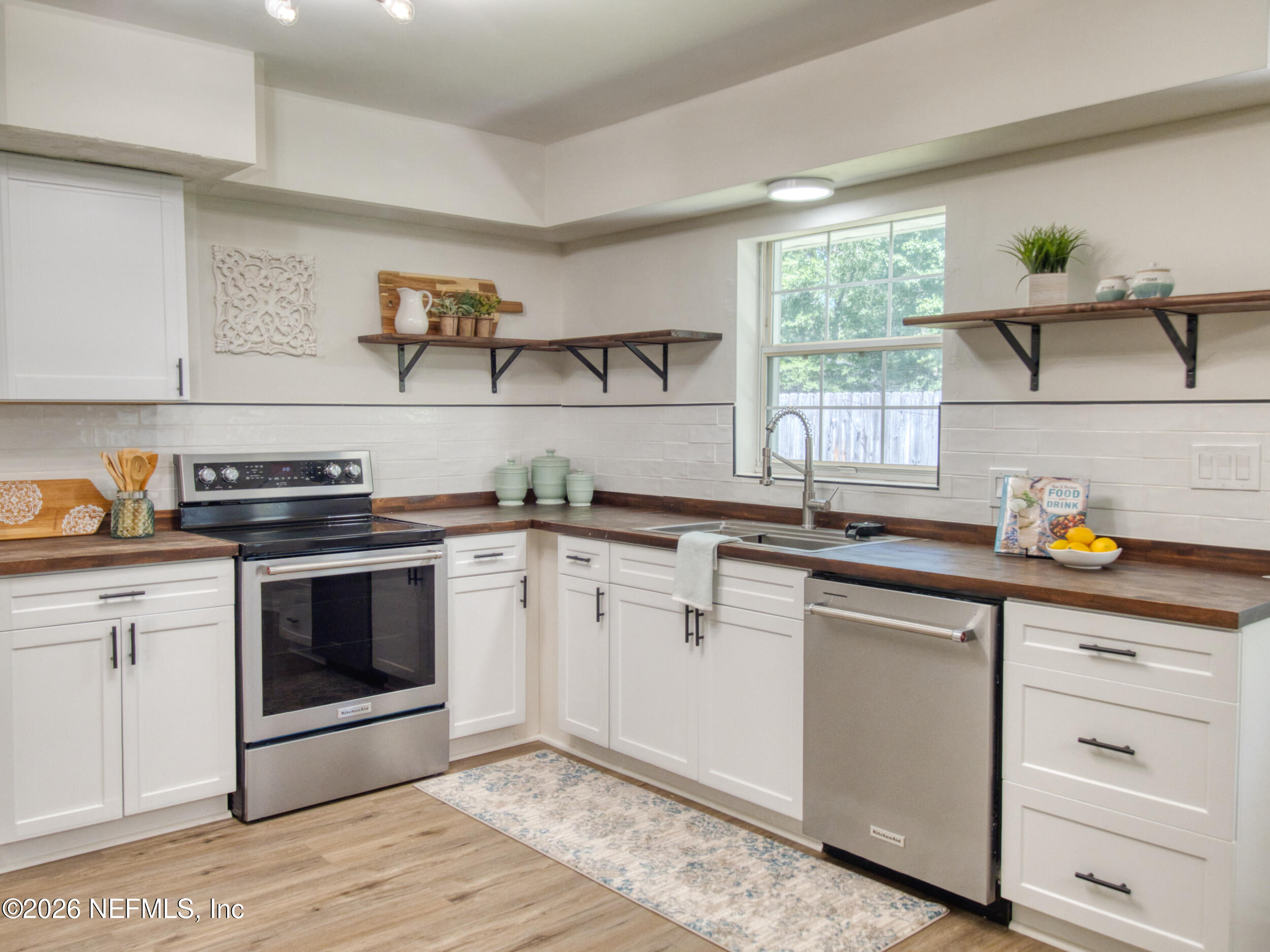 1110 Colley Road Starke, FL 32091 - Photo 59 of 60 a kitchen with cabinets appliances and a window