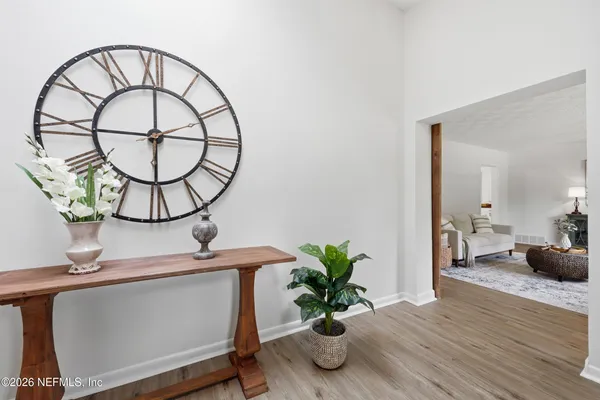 a kitchen with stainless steel appliances a stove a sink and a microwave