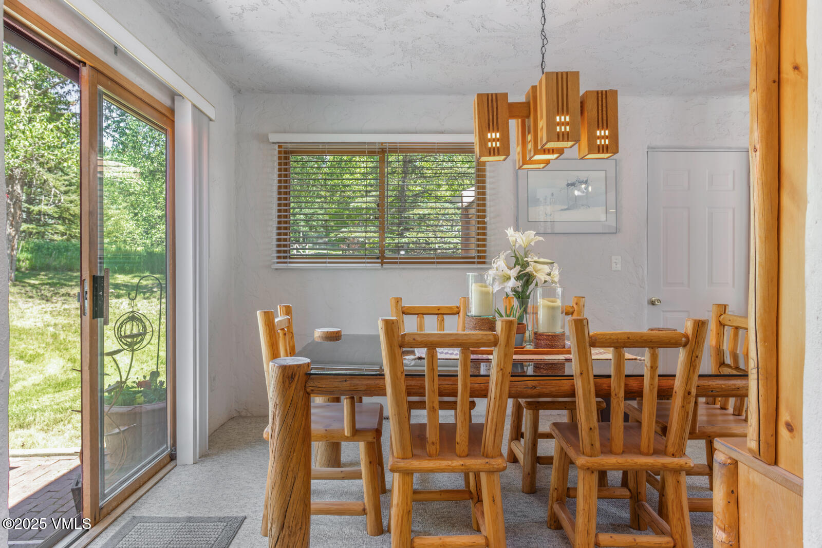 20 Hereford Road Edwards, CO 81632 - Photo 6 of 32 a dining room with furniture a chandelier and wooden floor