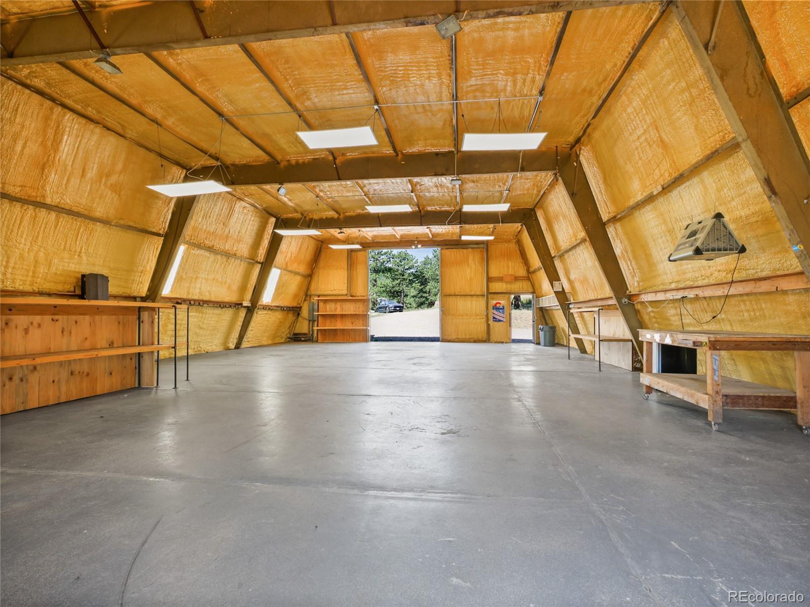 1044 South Grapevine Road Golden, CO 80401 - Photo 32 of 46 a view of a garage with wooden floor