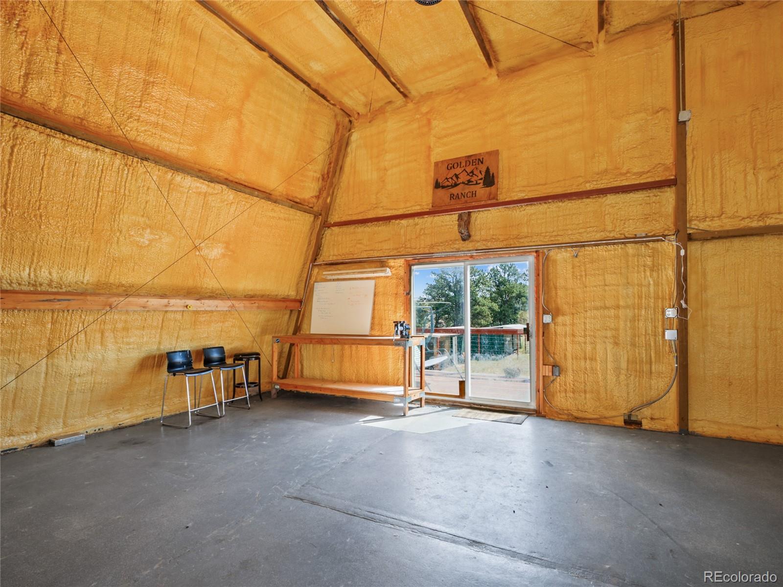 1044 South Grapevine Road Golden, CO 80401 - Photo 33 of 46 a view of a room with a garage