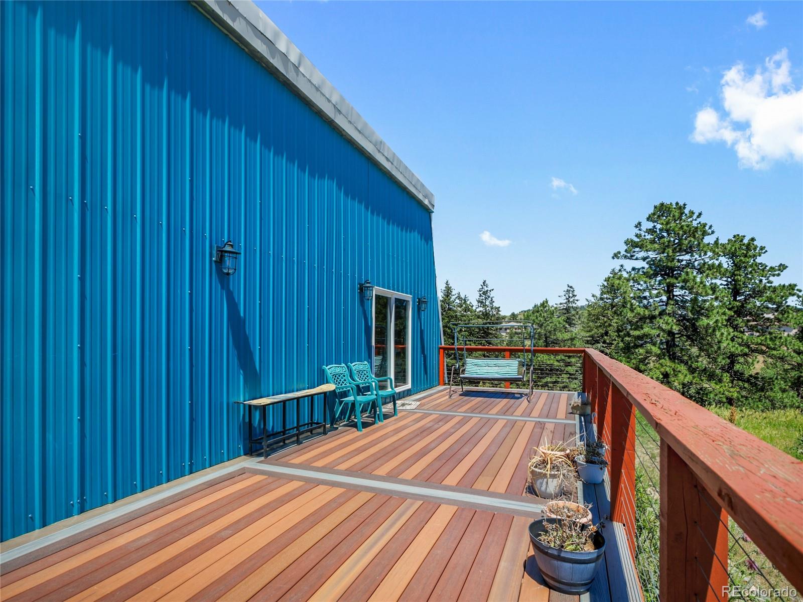 1044 South Grapevine Road Golden, CO 80401 - Photo 34 of 46 a view of balcony with wooden floor and outdoor seating