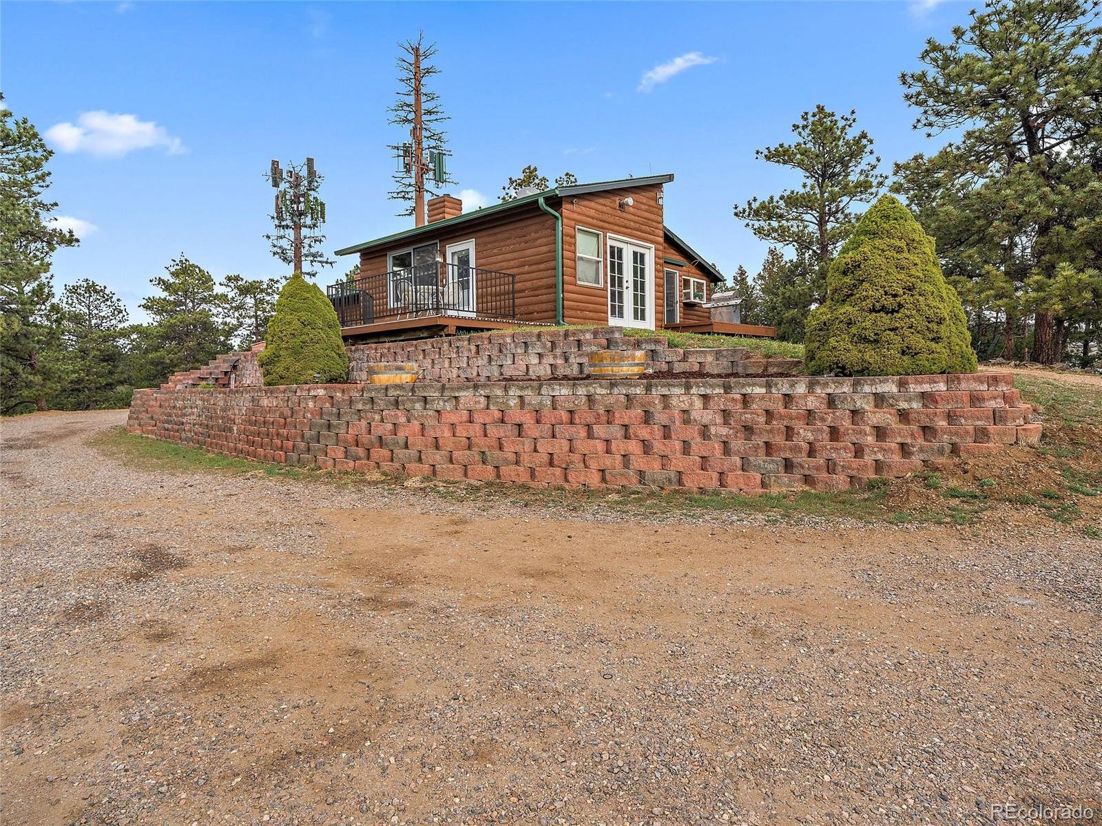 1044 South Grapevine Road Golden, CO 80401 - Photo 4 of 46 a view of a house with a street
