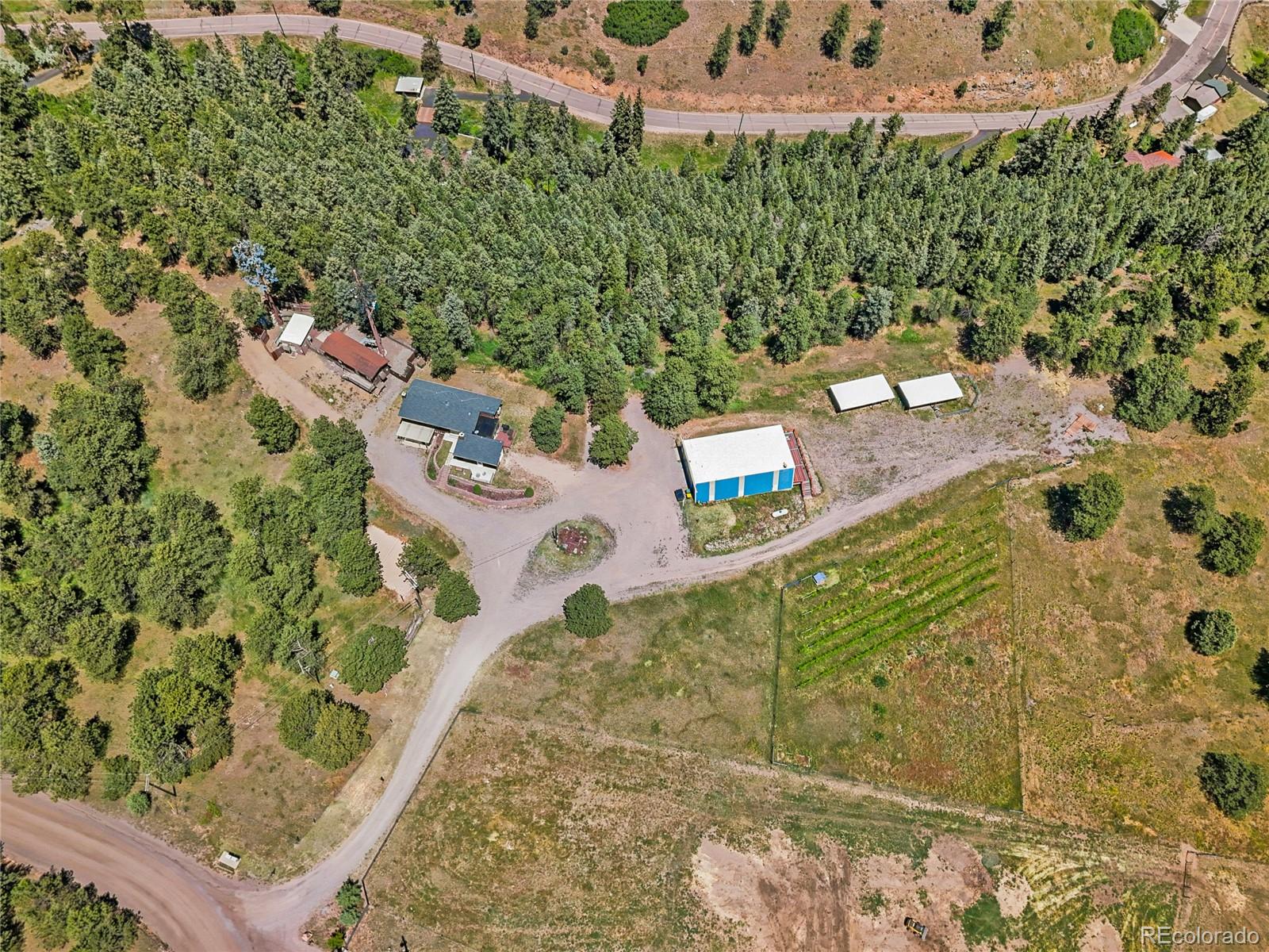 1044 South Grapevine Road Golden, CO 80401 - Photo 43 of 46 an aerial view of a house with a yard