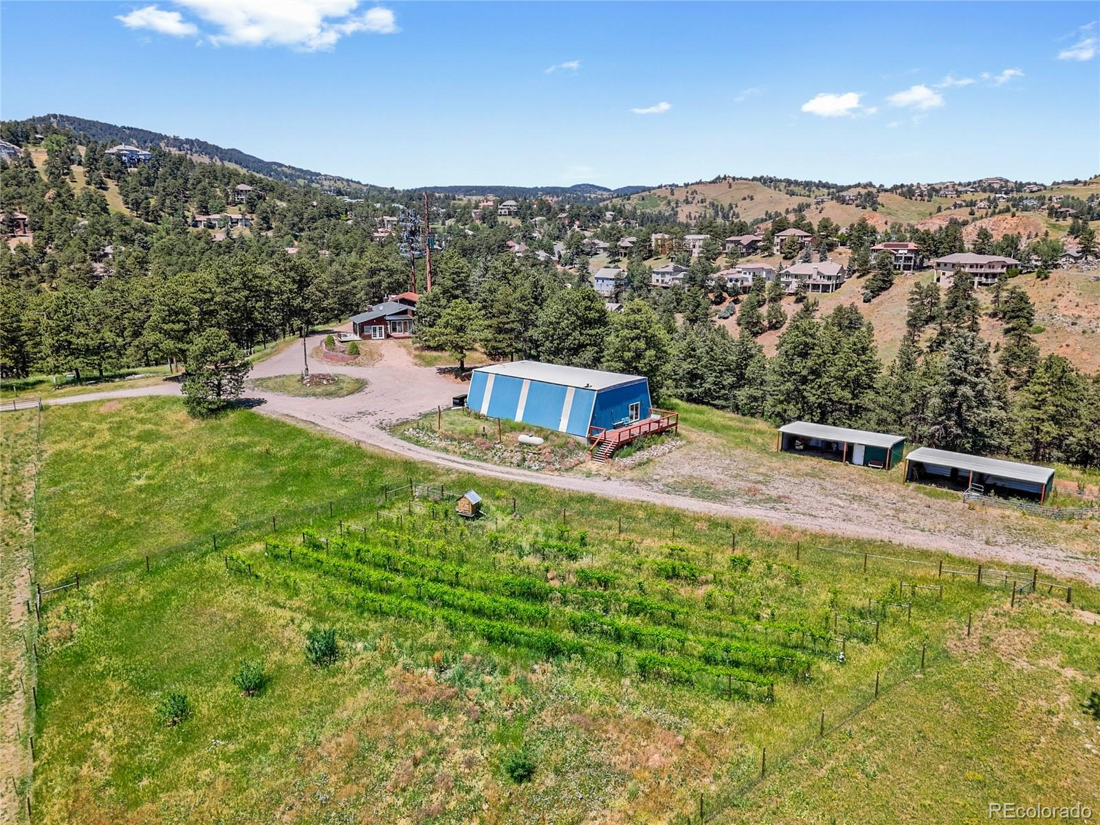 1044 South Grapevine Road Golden, CO 80401 - Photo 45 of 49 a view of a swimming pool with a yard