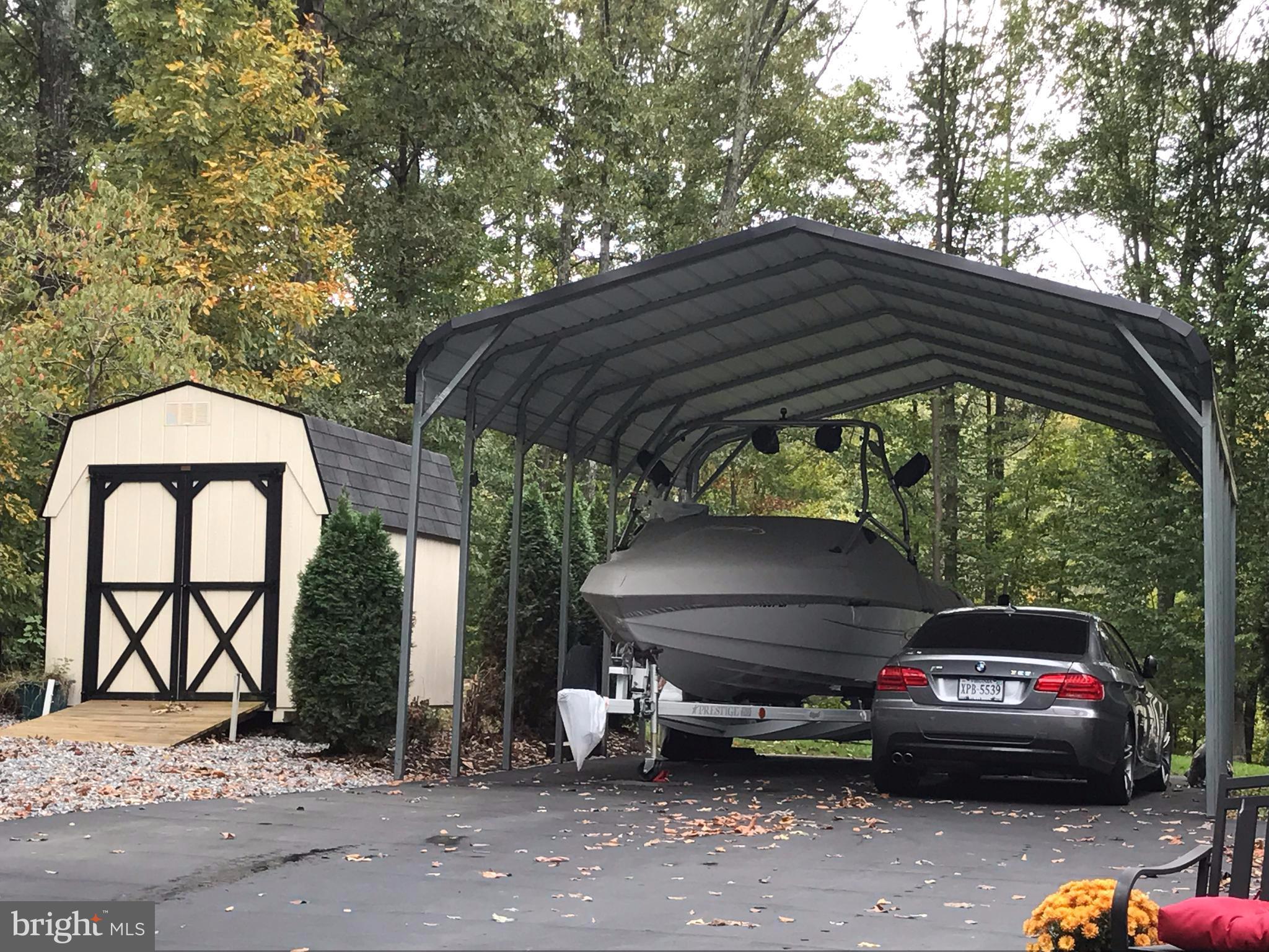 80 Elnor Road Bumpass, VA 23024 - Photo 22 of 25 12' high metal carport for big toys. 8x12 shed.