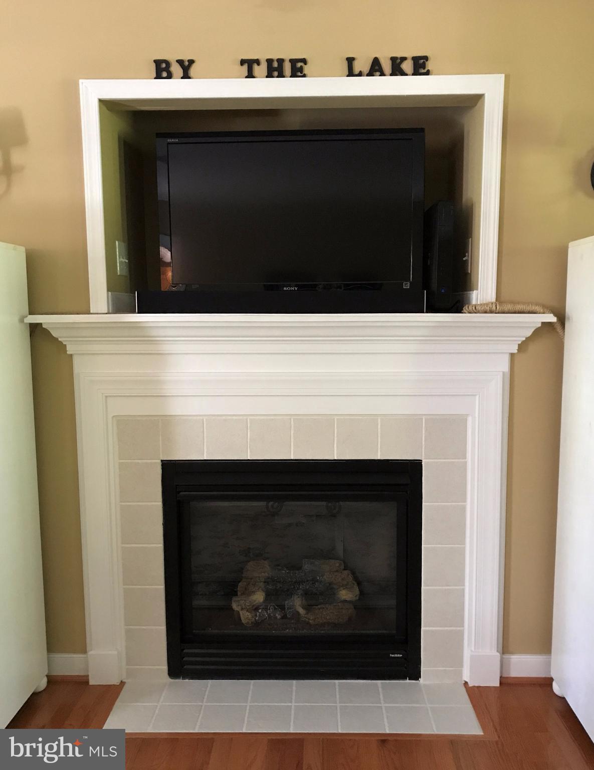 80 Elnor Road Bumpass, VA 23024 - Photo 5 of 25 Fireplace with gas logs and tile surround