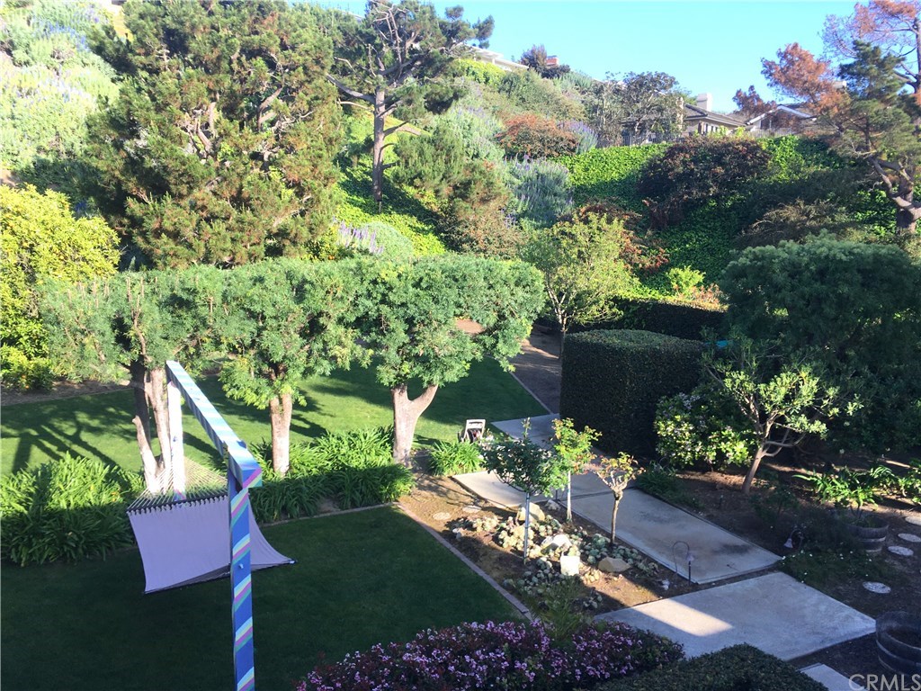 An ENORMOUS rear yard in the center of Corona Del Mar . . . .