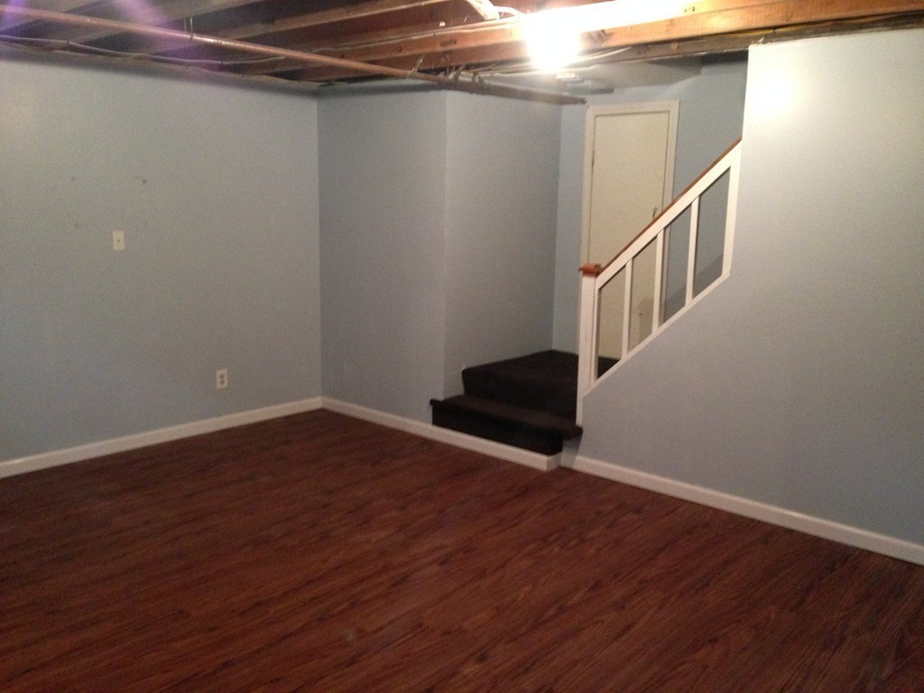 137 Maxwell Road Monson, MA 01057 - Photo 19 of 21 a view of a hallway with wooden floor and staircase
