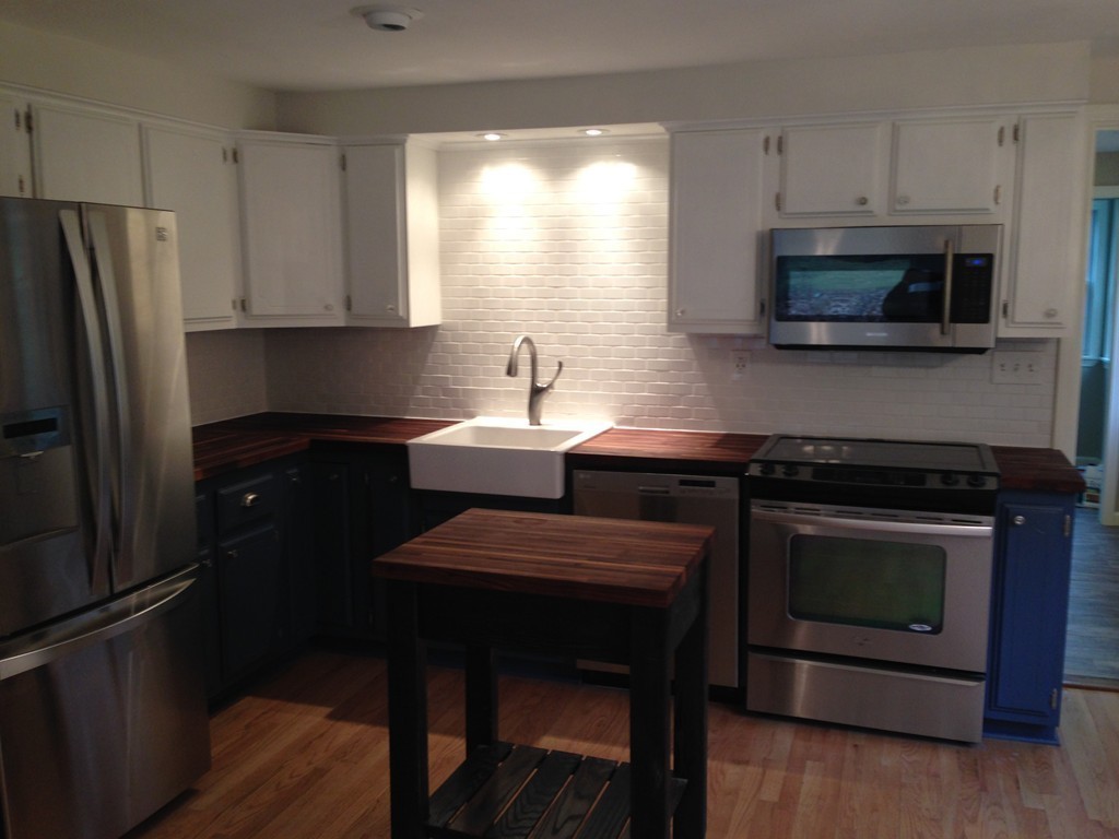 137 Maxwell Road Monson, MA 01057 - Photo 3 of 21 a kitchen with stainless steel appliances a stove microwave and refrigerator