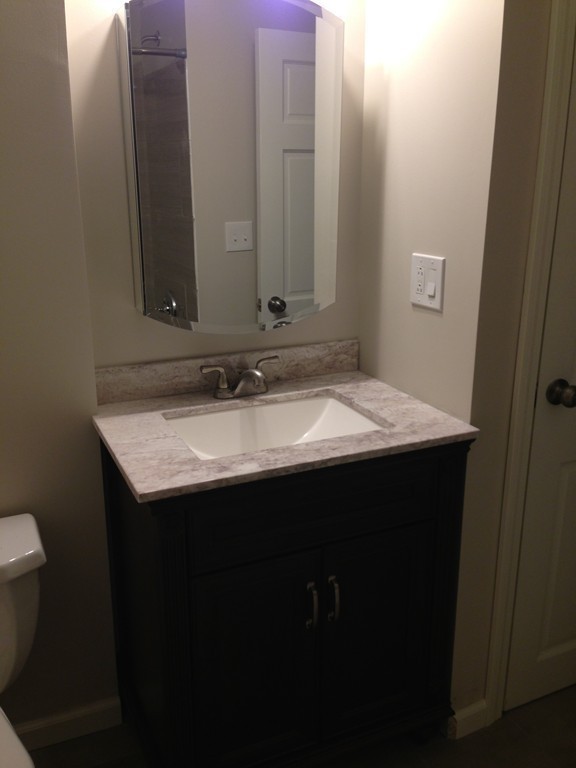 137 Maxwell Road Monson, MA 01057 - Photo 9 of 21 a bathroom with a sink and a mirror