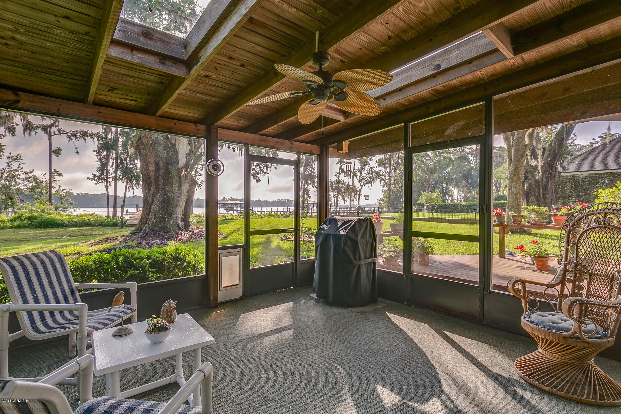 5562 Steamboat Road St. Augustine, FL 32092 - Photo 13 of 49 a view of a porch with furniture and garden