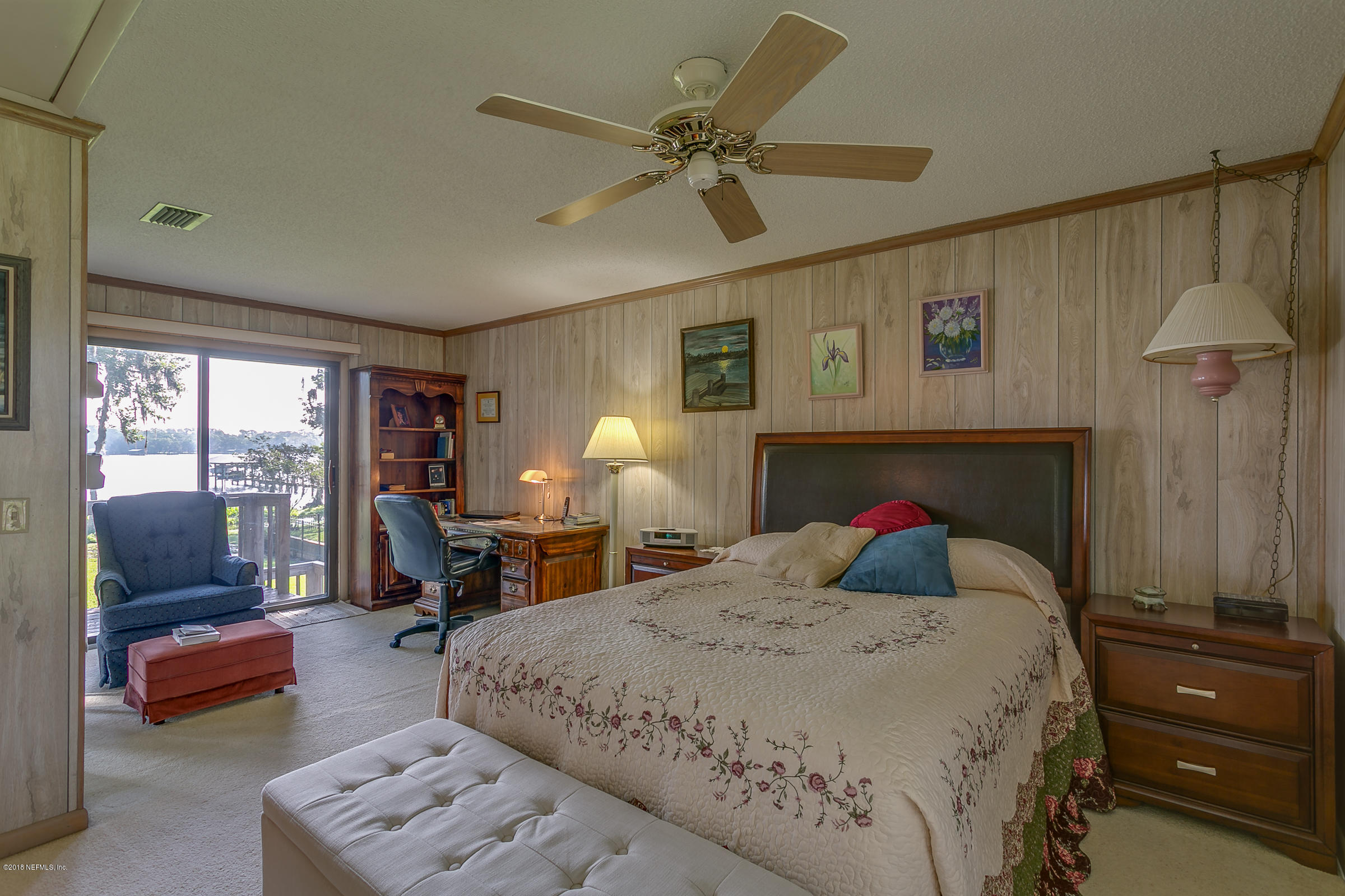 5562 Steamboat Road St. Augustine, FL 32092 - Photo 16 of 49 a bed room with a bed and a chair