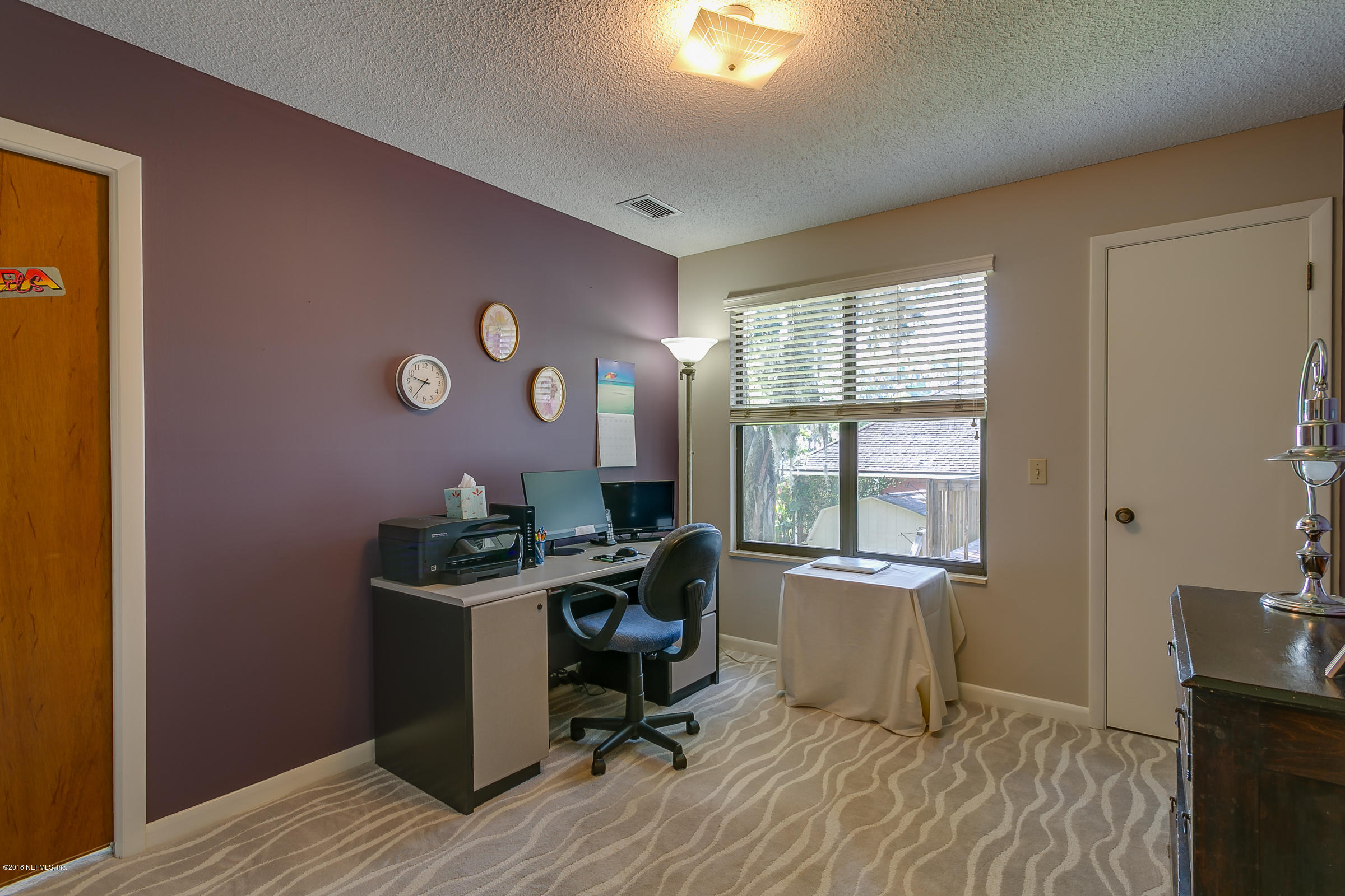 5562 Steamboat Road St. Augustine, FL 32092 - Photo 23 of 49 a view of a workspace with furniture and a window