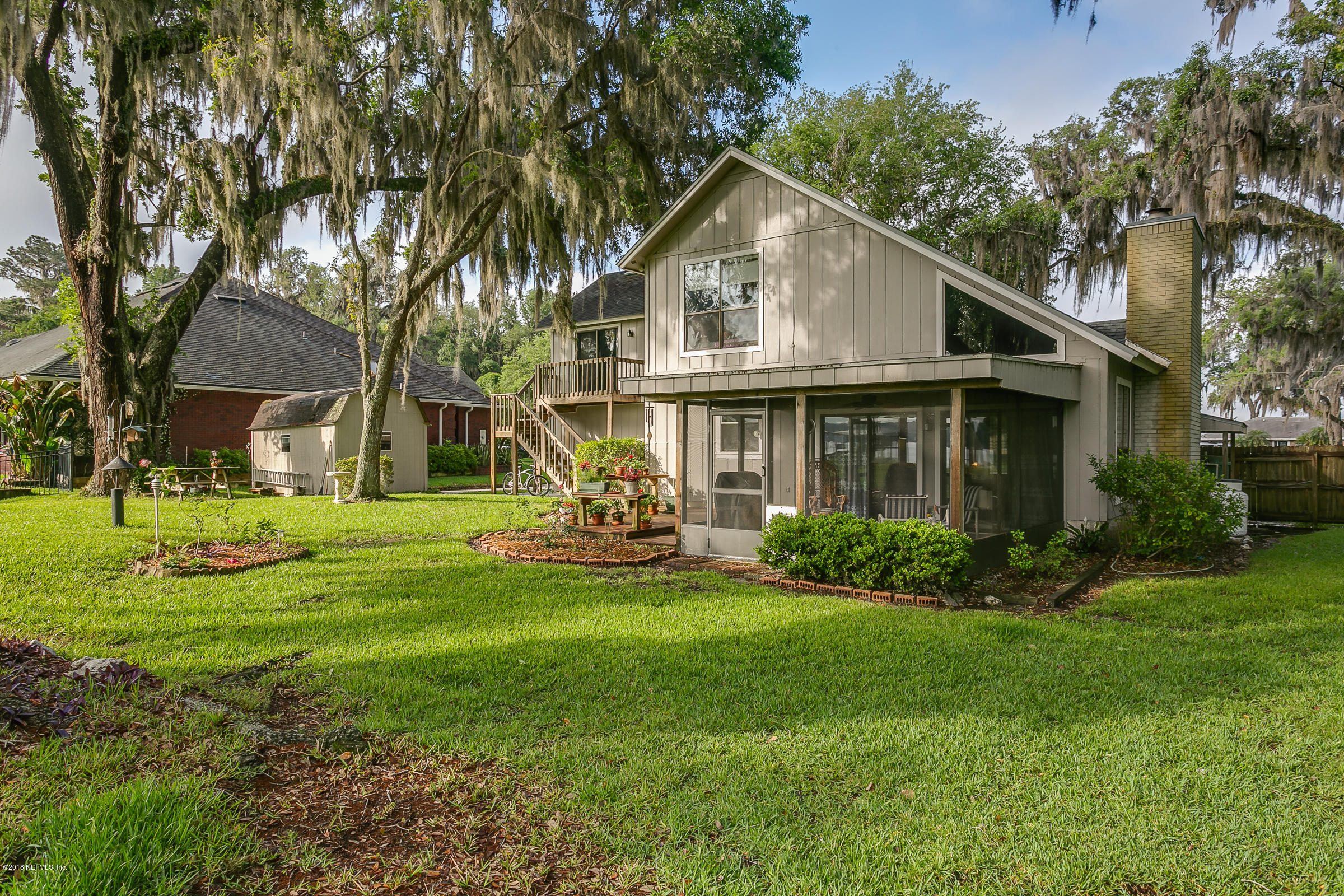 5562 Steamboat Road St. Augustine, FL 32092 - Photo 29 of 49 a view of a house with a yard and plants