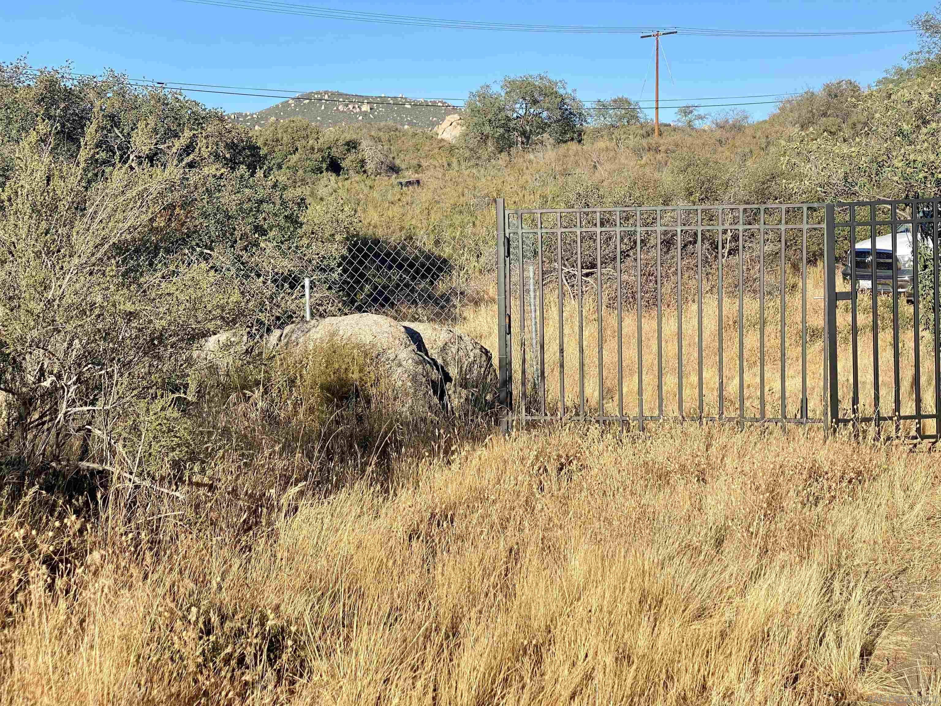 a view of a yard and mountain