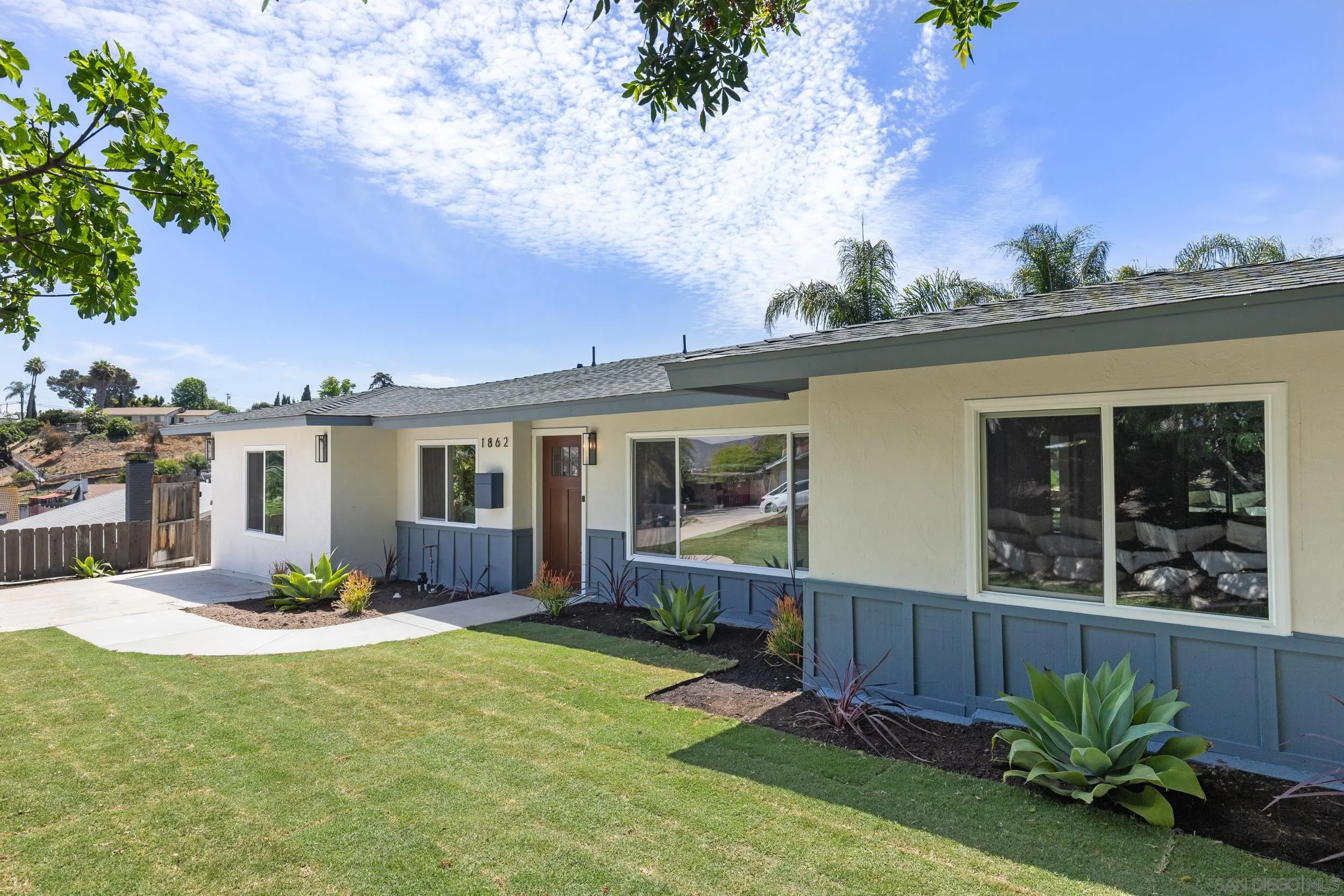 1862 Washington Street Lemon Grove, CA 91945 - Photo 2 of 32 a front view of a house with garden