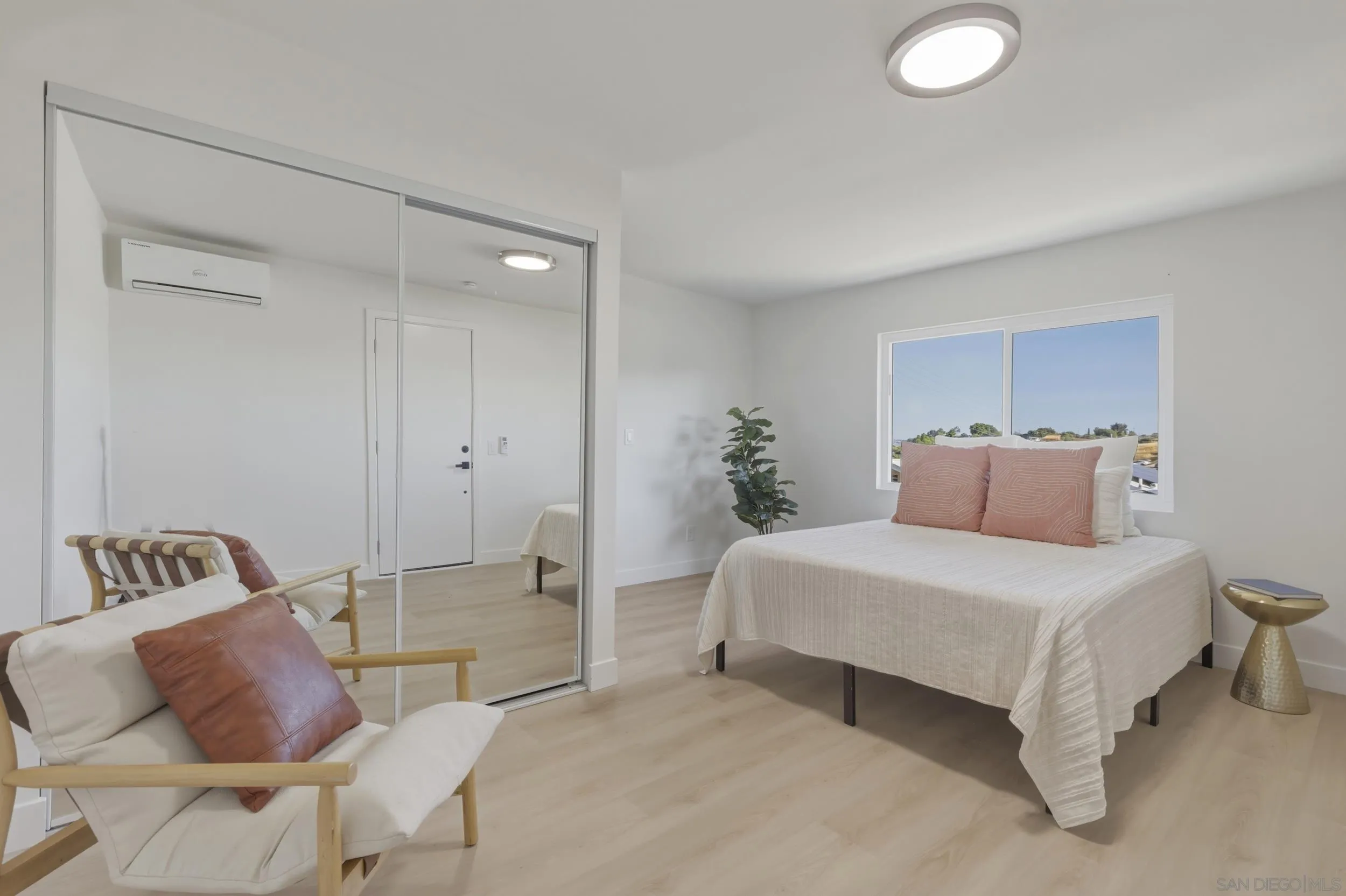 1862 Washington Street Lemon Grove, CA 91945 - Photo 21 of 32 a bedroom with a bed and chair