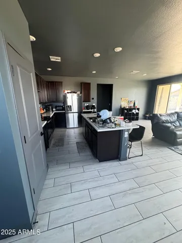 a spacious bedroom with a bed and a walk in closet