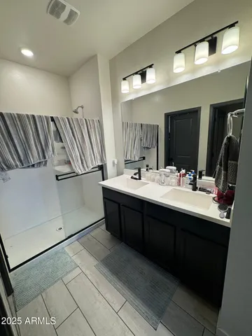a view of bathroom with a toilet and a sink