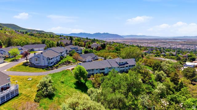 3766 Cardiff Circle Bountiful, UT 84010 - Photo 43 of 46 Hillside community featuring multiple residential structures with dark roofs and light-colored siding