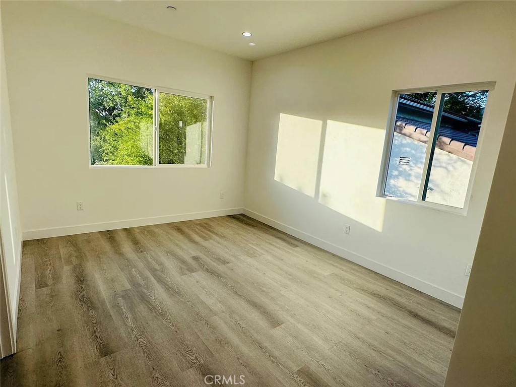 22823 Crespi Street Woodland Hills, CA 91364 - Photo 12 of 15 an empty room with windows