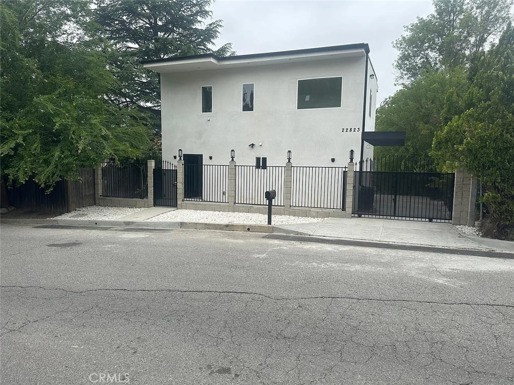 22823 Crespi Street Woodland Hills, CA 91364 - Photo 14 of 15 a view of a house with a backyard of a house