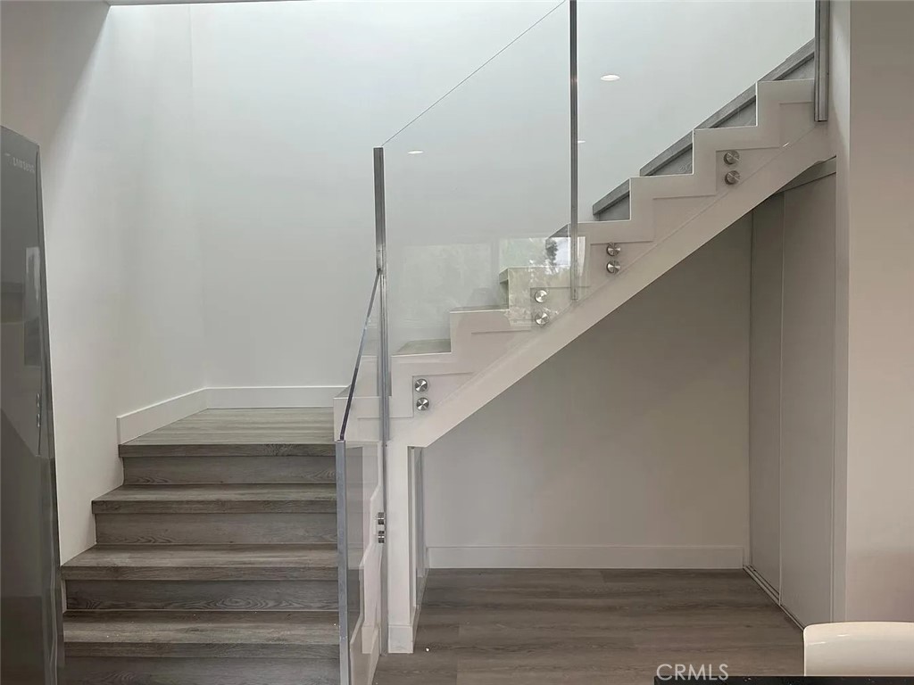 22823 Crespi Street Woodland Hills, CA 91364 - Photo 6 of 15 a view of entryway and hall with wooden floor