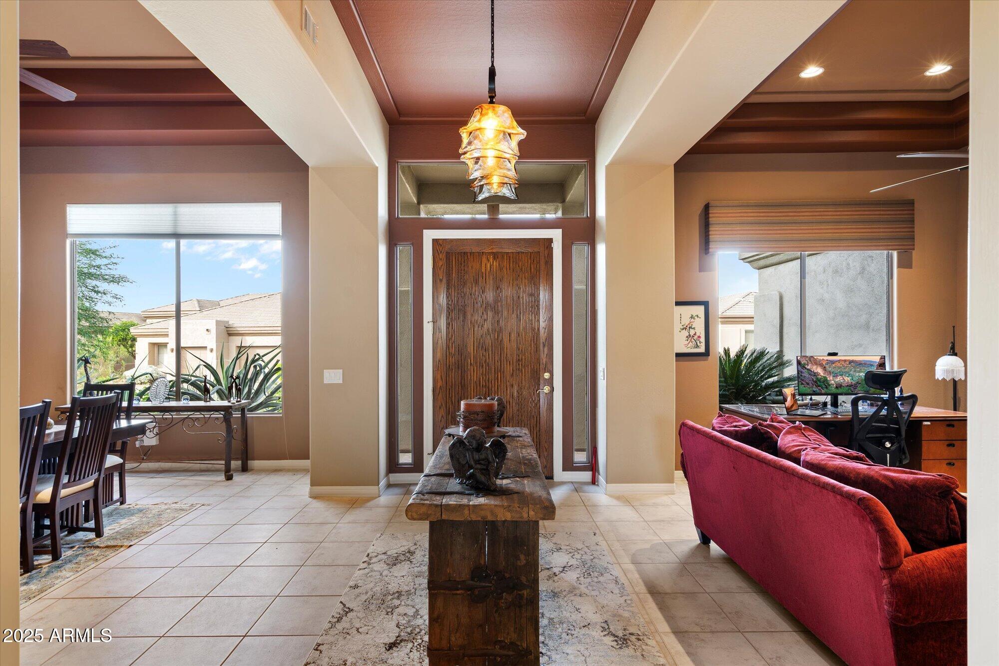 6867 East Crimson Sky Trail Scottsdale, AZ 85266 - Photo 12 of 97 a dining room with furniture and wooden floor