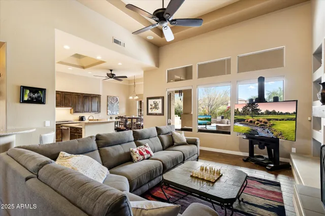a kitchen with granite countertop a sink a counter top space and stainless steel appliances