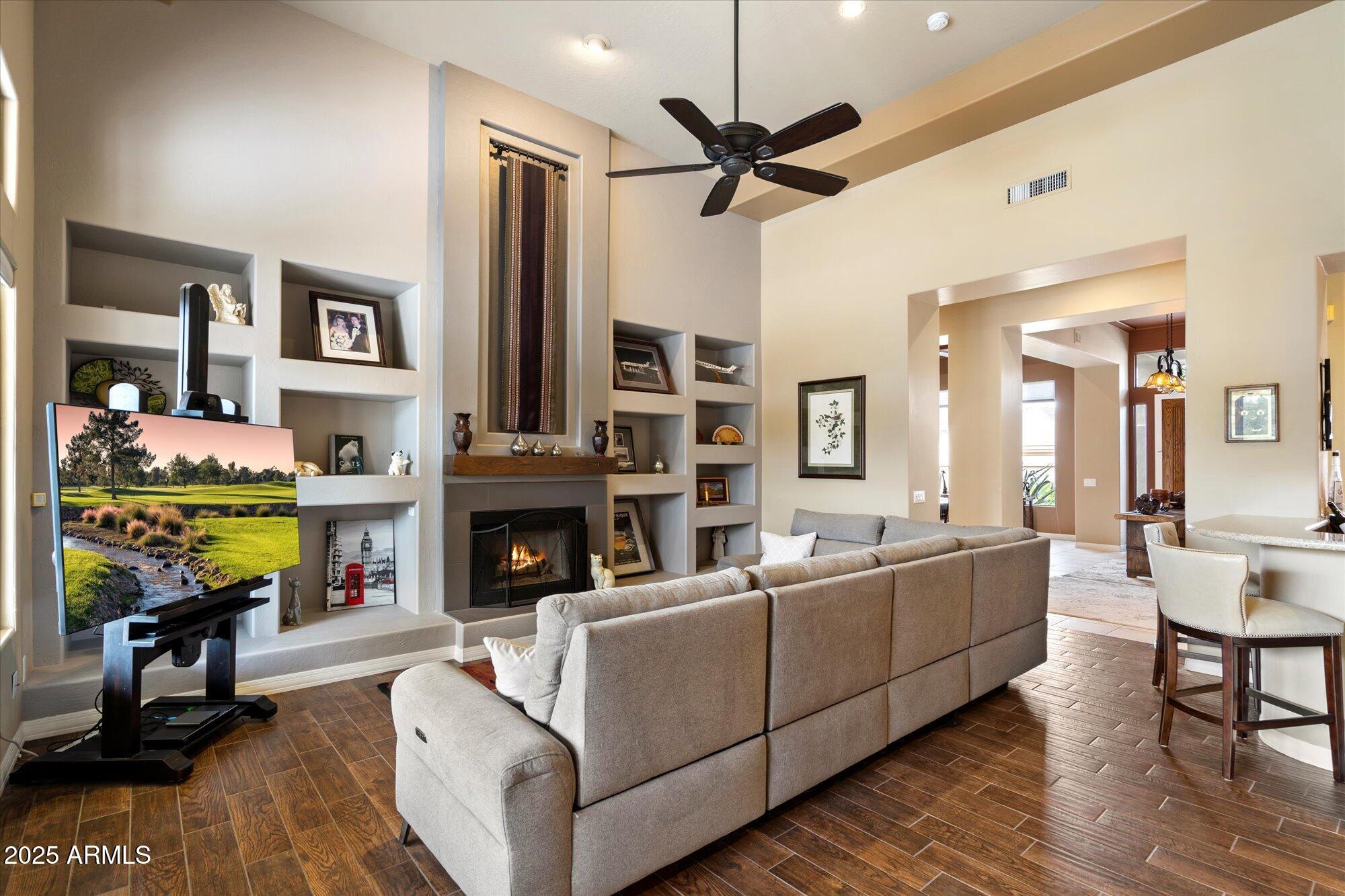 6867 East Crimson Sky Trail Scottsdale, AZ 85266 - Photo 18 of 97 a living room with furniture and a fireplace