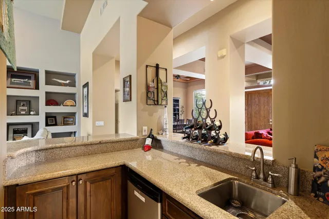 a spacious bathroom with a granite countertop tub sink and mirror