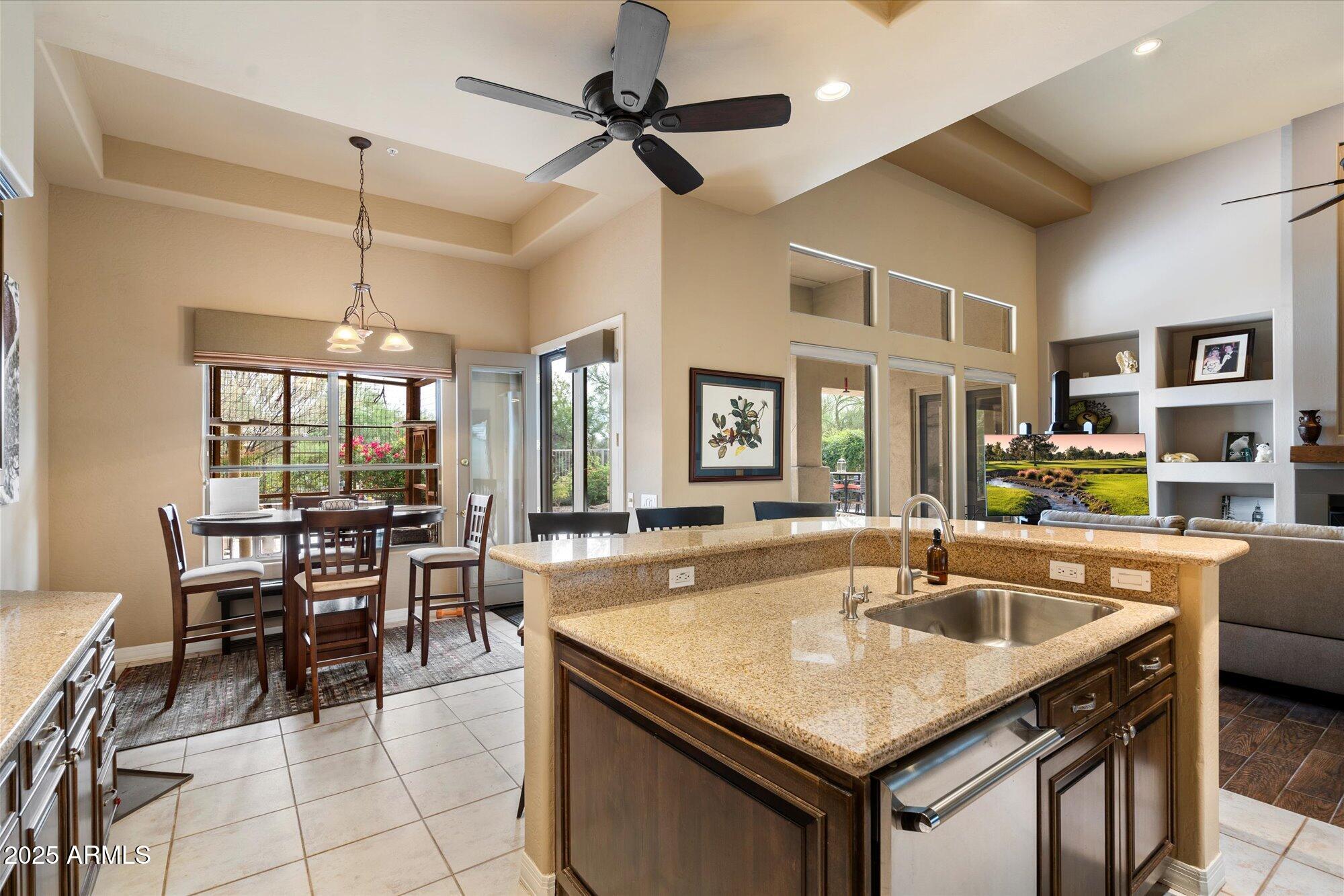 6867 East Crimson Sky Trail Scottsdale, AZ 85266 - Photo 22 of 97 a kitchen with granite countertop a sink a counter top space and stainless steel appliances