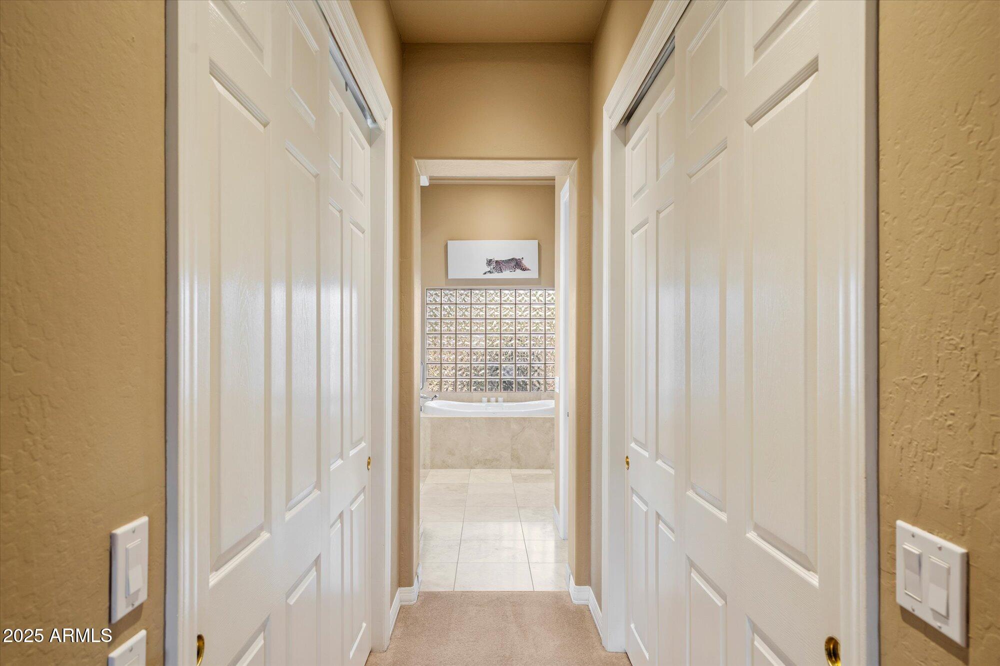 6867 East Crimson Sky Trail Scottsdale, AZ 85266 - Photo 27 of 97 a view of a bathroom from a hallway