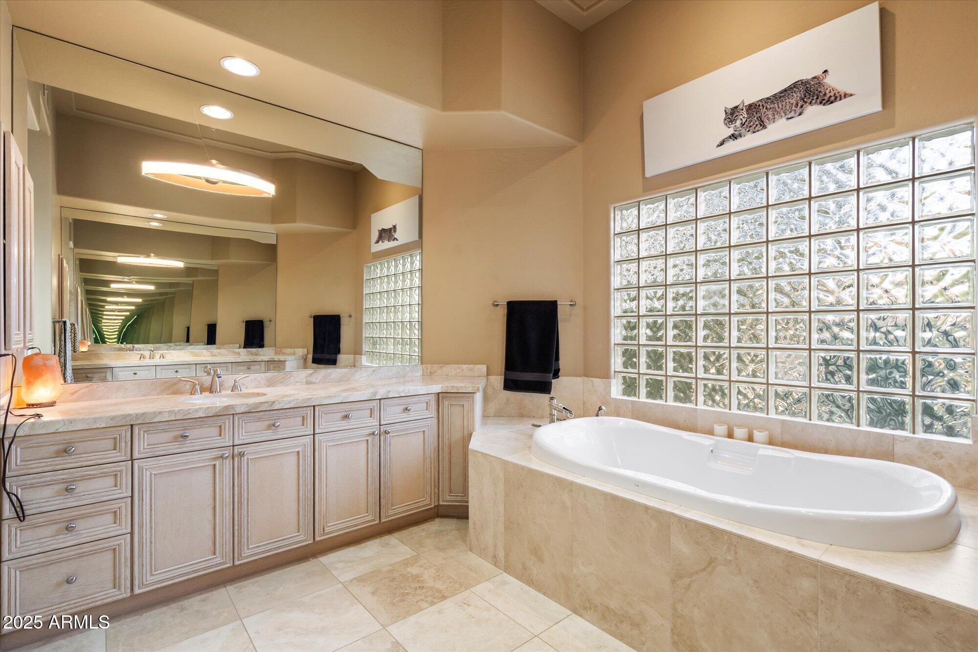 6867 East Crimson Sky Trail Scottsdale, AZ 85266 - Photo 29 of 97 a spacious bathroom with a granite countertop tub sink and mirror