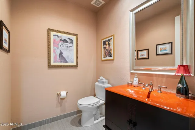 a living room with furniture and flowers