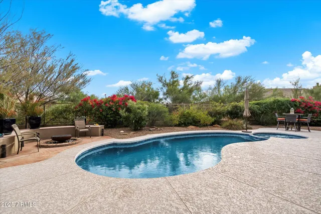 a view of city from balcony with seating space